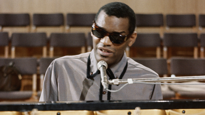 Ray Charles singing and playing piano