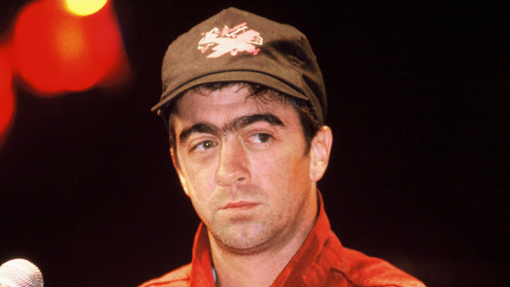 Bill Berry wearing a baseball cap