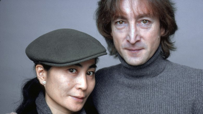 John lennon with arm round Yoko Ono