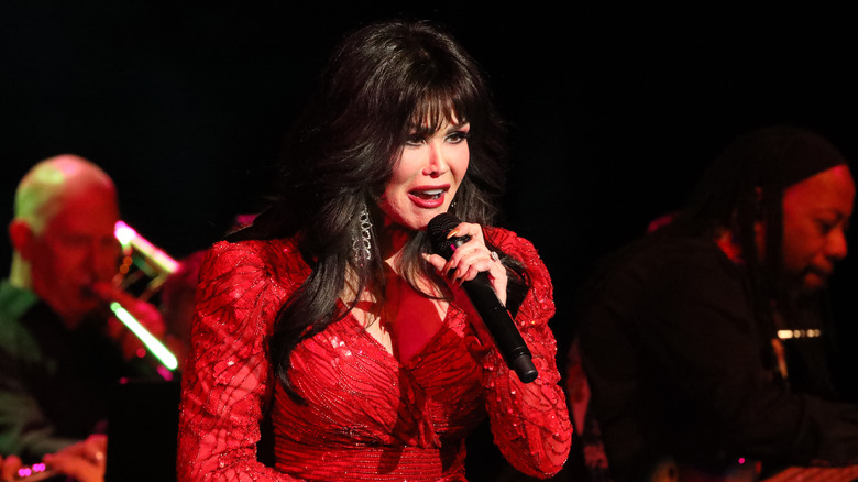 Marie Osmond  sings in red sequined dress