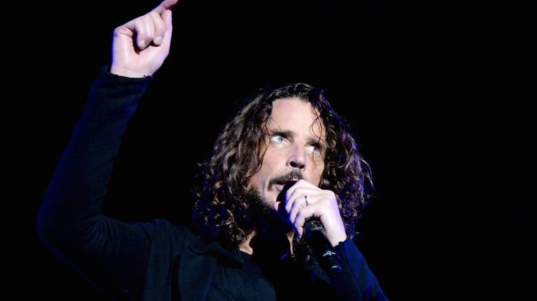 Chris Cornell singing and pointing on stage