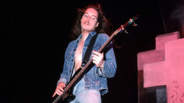 Cliff Burton playing bass on stage