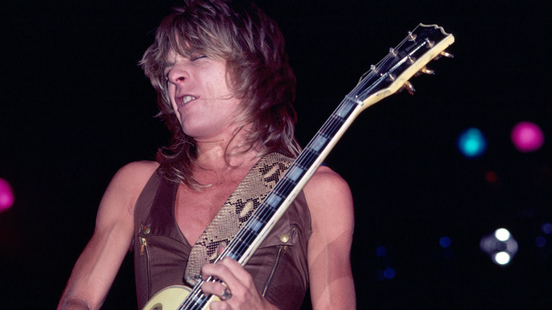 Randy Rhoads emotionally playing guitar