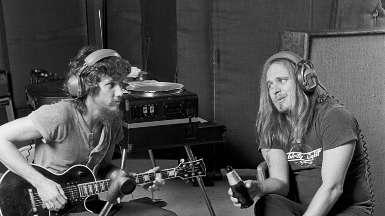 Ronnie Van Zant and Steve Gaines working in a studio