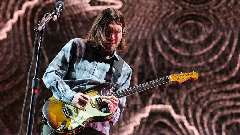 John Frusciante plays guitar