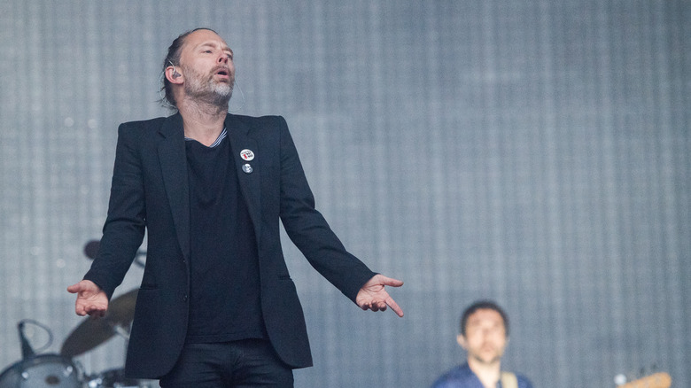 Thom Yorke shrugs on stage