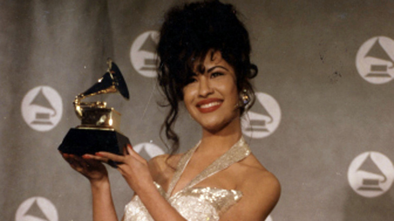 Selena holding a Grammy award 