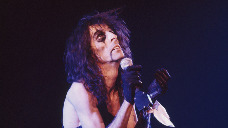 Alice Cooper in character looking up