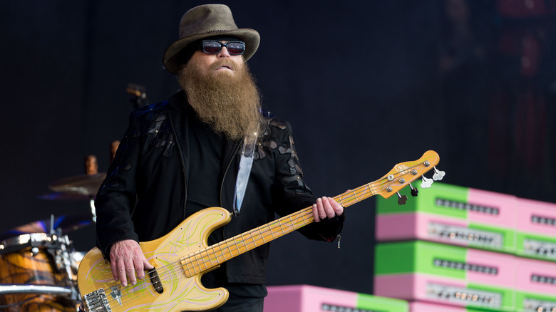 Dusty Hill playing guitar on stage