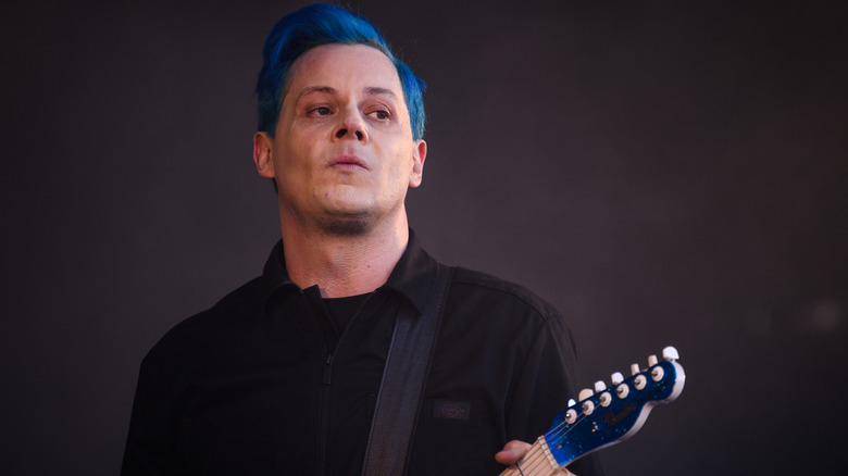 Jack White blue hair playing guitar