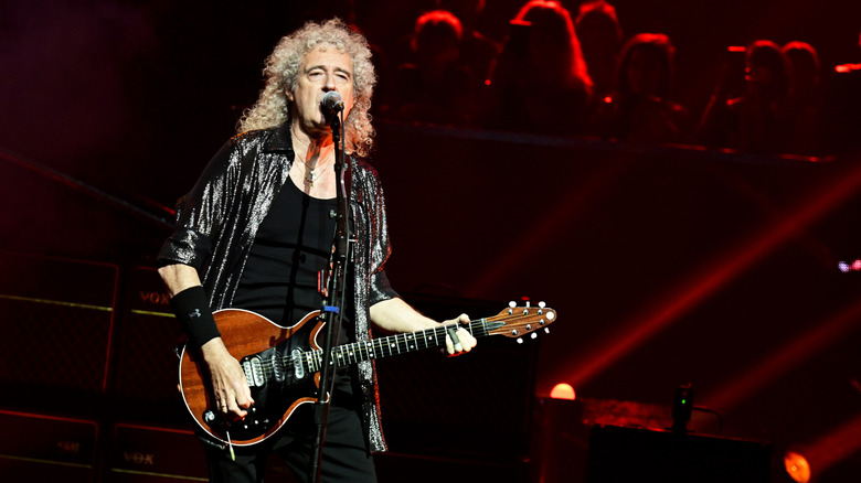 Brian May performing with Queen