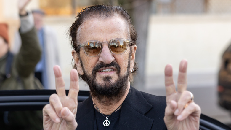 Ringo Starr offering a peace sign in 2024