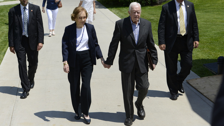 Jimmy and Rosalynn Carter holding hands