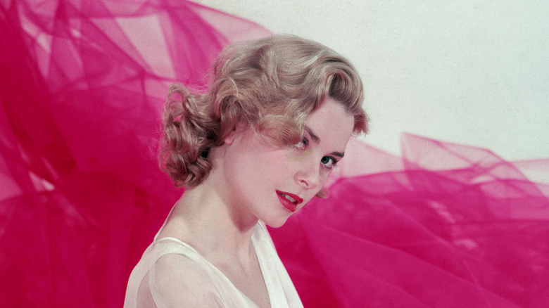 grace kelly posing purple fabric