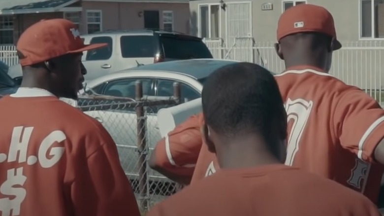 Bloods wearing red caps and jerseys