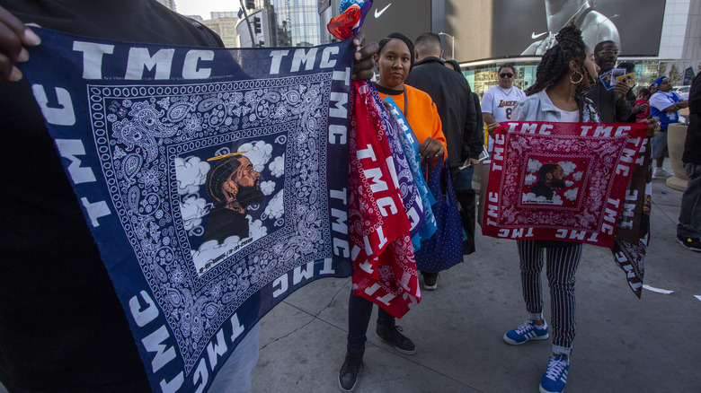 Women selling bandanas after Nipsey Hussle's murder