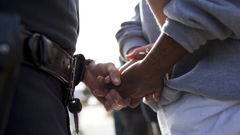 police officer handcuffing someone