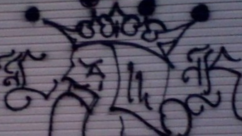 Latin Kings graffiti on a of wall