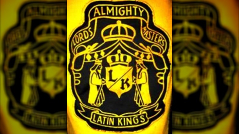 Latin Kings logo two kings holding a crest