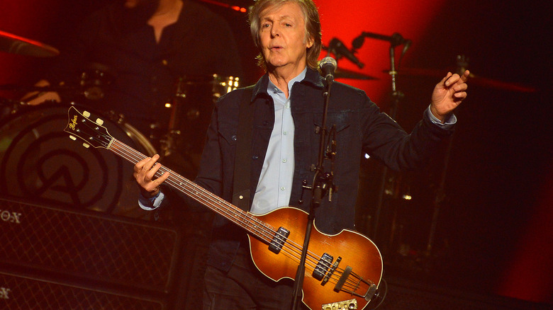 Paul McCartney performing on stage