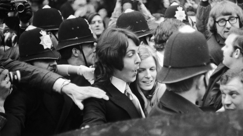 Paul and Linda McCartney in a crowd of people