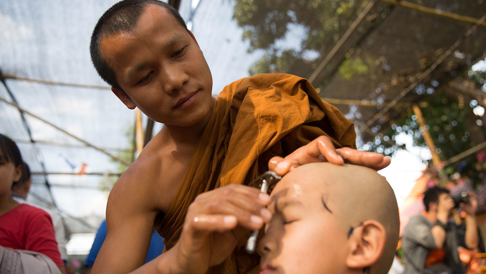 buddhist monk shaving head