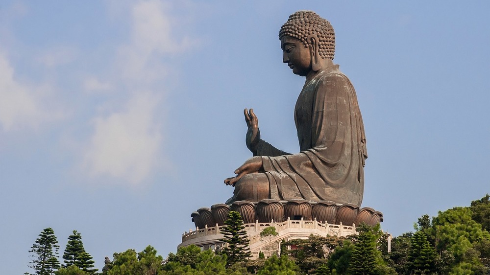 big buddha statue under blue sky