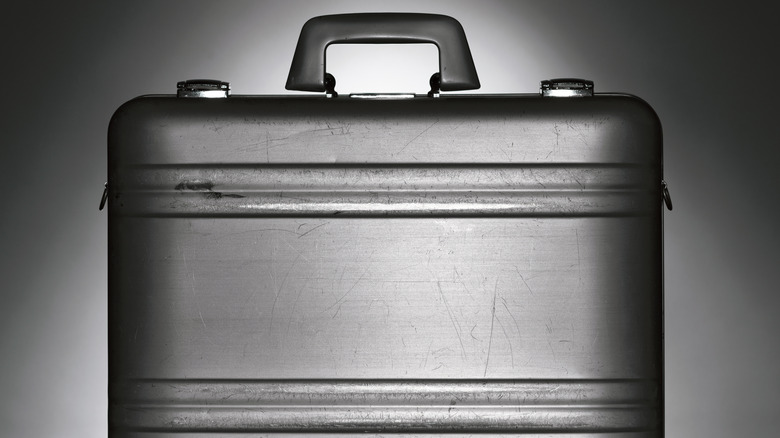 Metal briefcase white black background