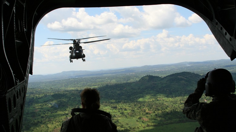 Chinook helicopter flying over landscape