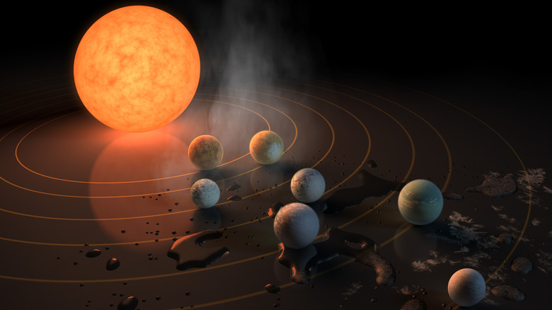 artist conception of a star and planets