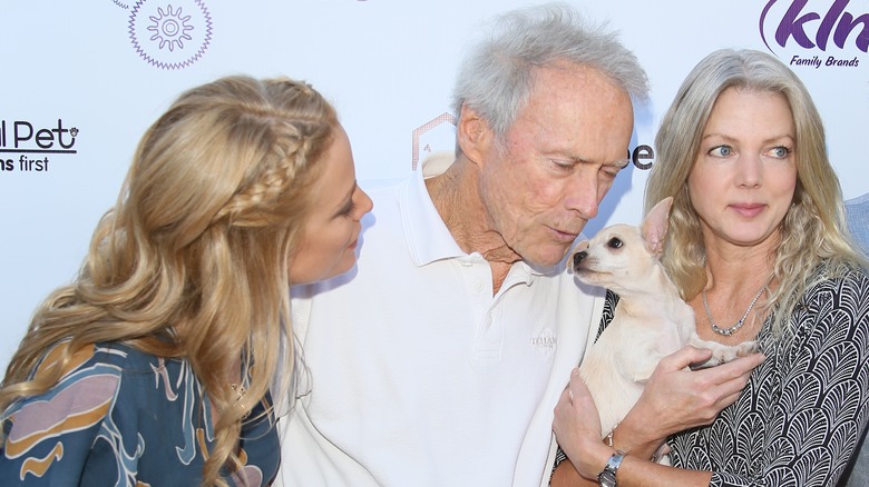 Clint Eastwood kissing puppy