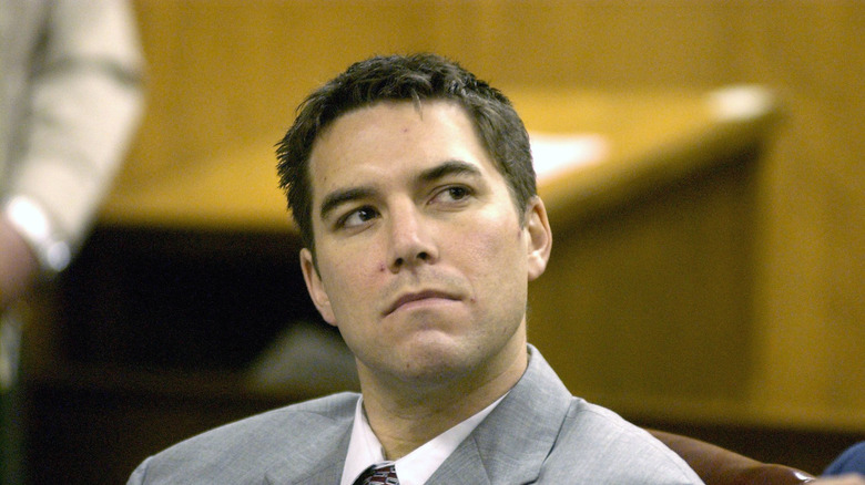 scott peterson looking up gray suit