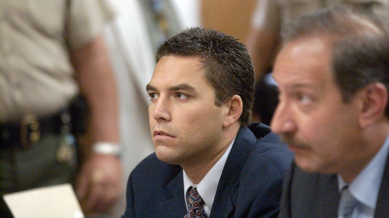 scott peterson looks side blue suit