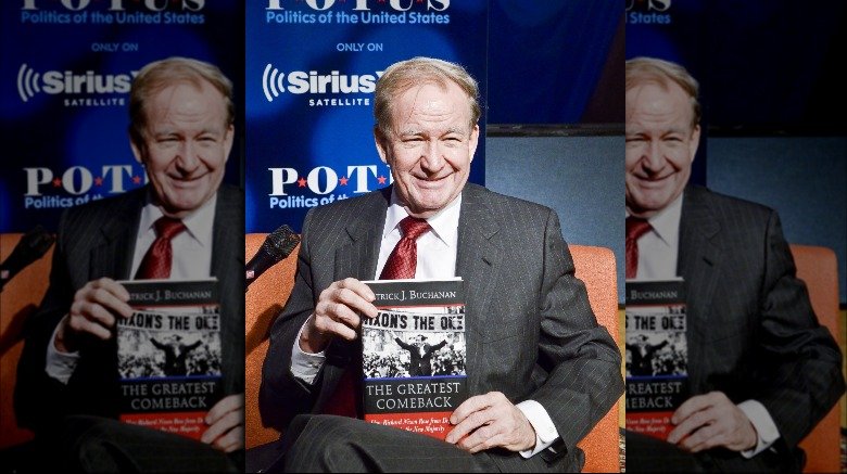 Pat Buchanan holding book