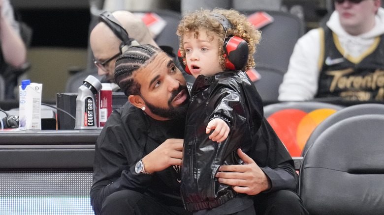 Drake with son Adonis courtside