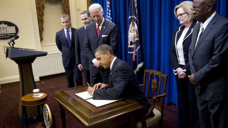 obama signing something