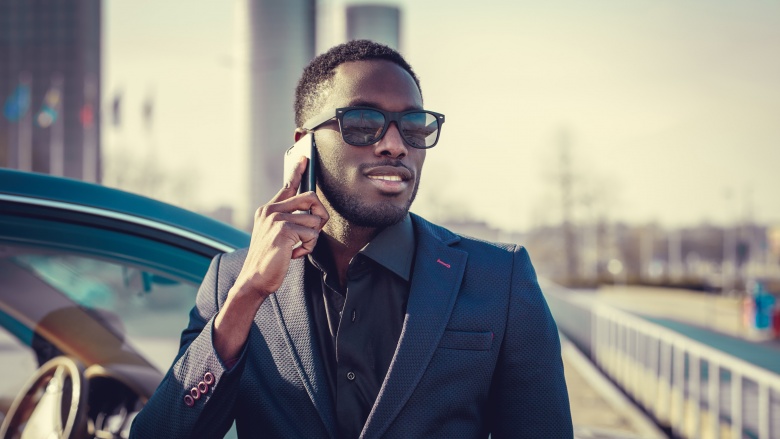 stylish black man with cell phone