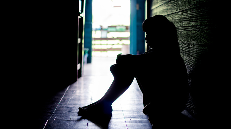 silhouette of girl sitting