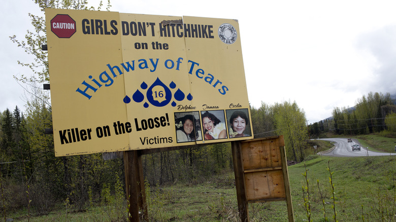 2016 yellow sign warning about Highway of Tears and identifying three victims.