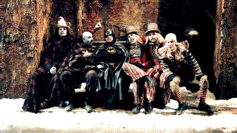 batman sits with evil clowns