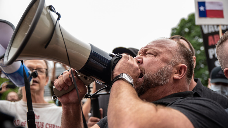 Alex Jones screaming into a bullhorn