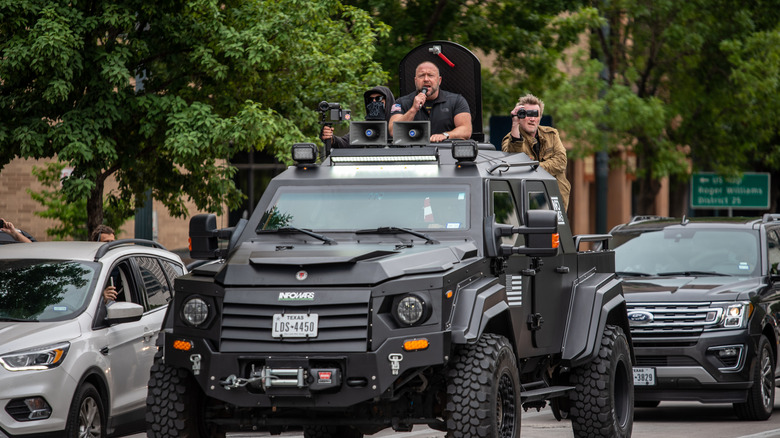 Alex Jones speaking from a ridiculous truck