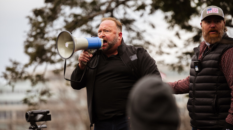 Alex Jones speaking into a bullhorn on January 6