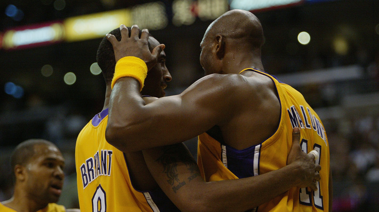 Kobe Bryant and Karl Malone congratulate each other