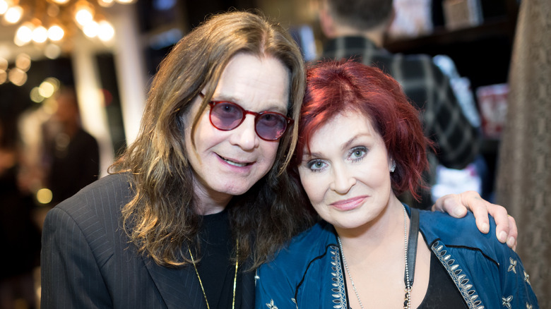 Ozzy Osbourne with arm around Sharon Osbourne