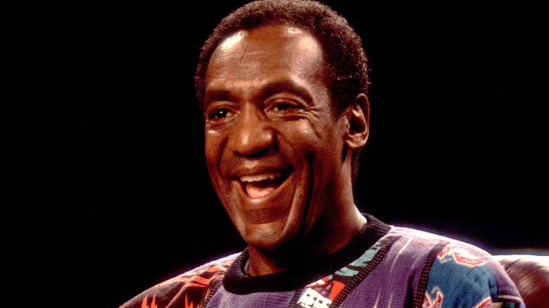 bill cosby laughing on stage sweater