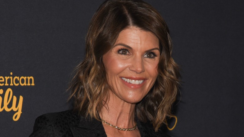 lori loughlin clenched teeth looking off