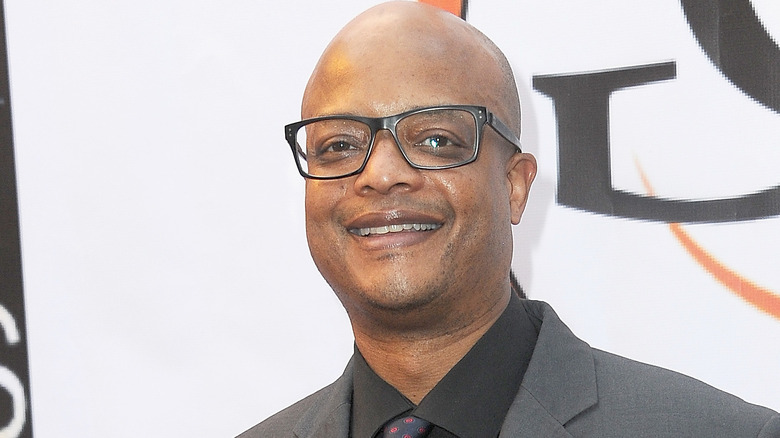 todd bridges smiling glasses gray suit