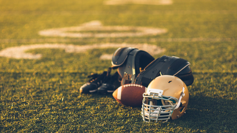 football gear laying on a field