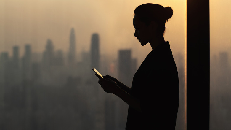 shadowy woman making a phone call